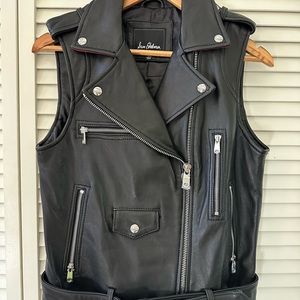 Leather motor vest. Brand new. Black with zippers. Calf leather. Soft and comfy.